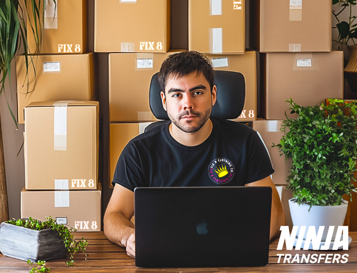 Photo of DIY home/office-based fulfillment center (heat press, shipping supplies, etc) or a t-shirt entrepreneur sitting next to stacks of boxes ready to ship