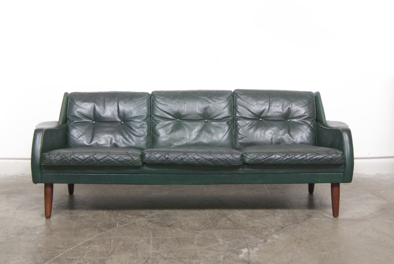 dark green leather sofa