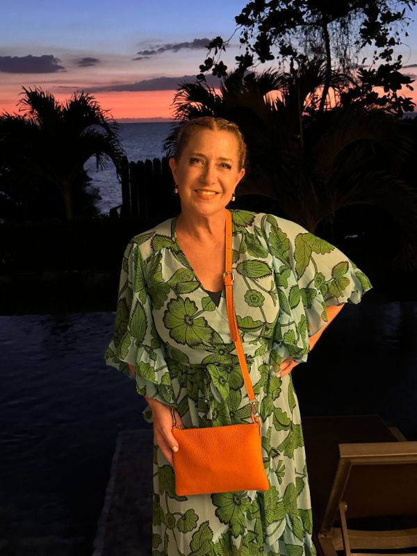 Nancy Stoltz with her Endrizzi Borsetta 2-zipper bag in orange in Jamaica