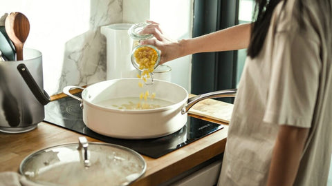 Cooking gluten-free macaroni in the ceramic non-stick Cosmo Pan.