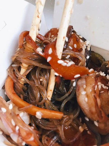 Glass noodles up close from a japchae dish. Photo by chudesabyvaut.