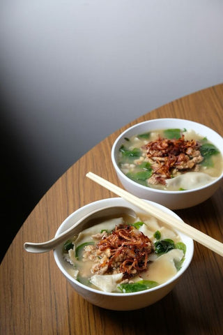 Hand-torn ban mian in anchovy broth, also known as ikan bilis broth. Photo by Kuan Heon Lau.