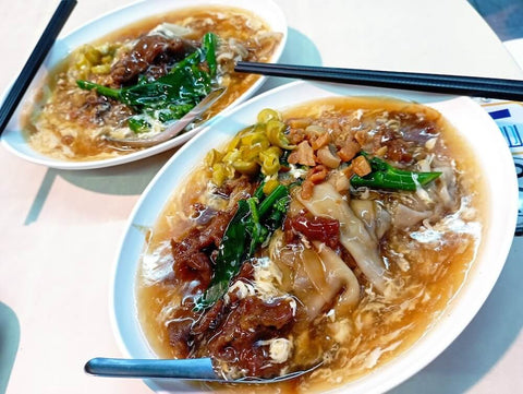 Hor fun noodles in rich gravy. Photo by SingWei Wong.