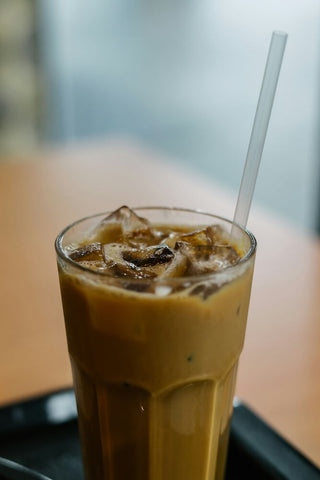 Kopi peng in a tall glass. Photo by bady abbas.