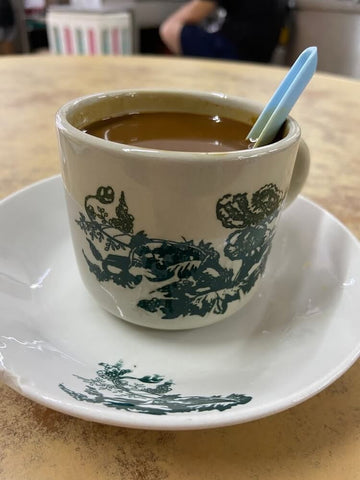 Kopi served in traditional ceramic cup and saucer. Photo by Wilson Foo.