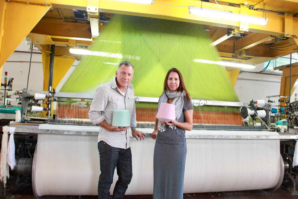 Albert & Shannon - Co Founders of the Riviera Towel Company In front of their Jacquard Loom in Turkey