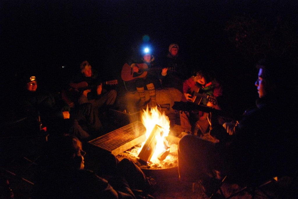 group of campers enjoying the campfire