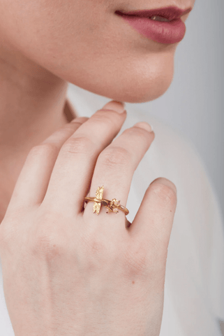 Amanda coleman's dragonfly ring on a model's hand to showcase the ring