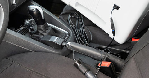 Photo of cooler plugged in inside a vehicle using the battery saver