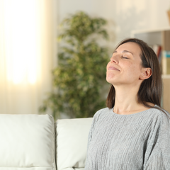 Woman on couch breathing