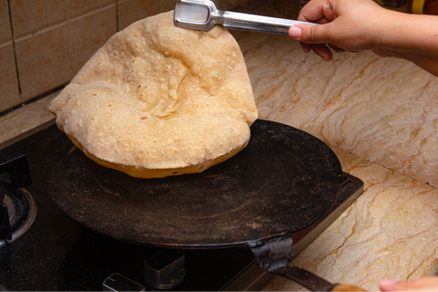 A person preparing roti