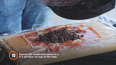 Step 10: Spread the mushroom blend in a 0.5 cm layer on top of the ham. 