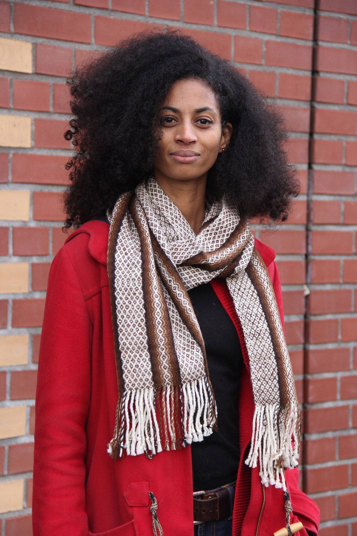 A woman with a colorful alpaca scarf