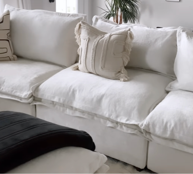 white sofa with a pillow