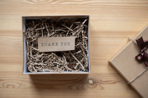 A gift box with a thank you note