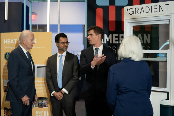 President Biden laughs with Gradient CEO Vince Romanin