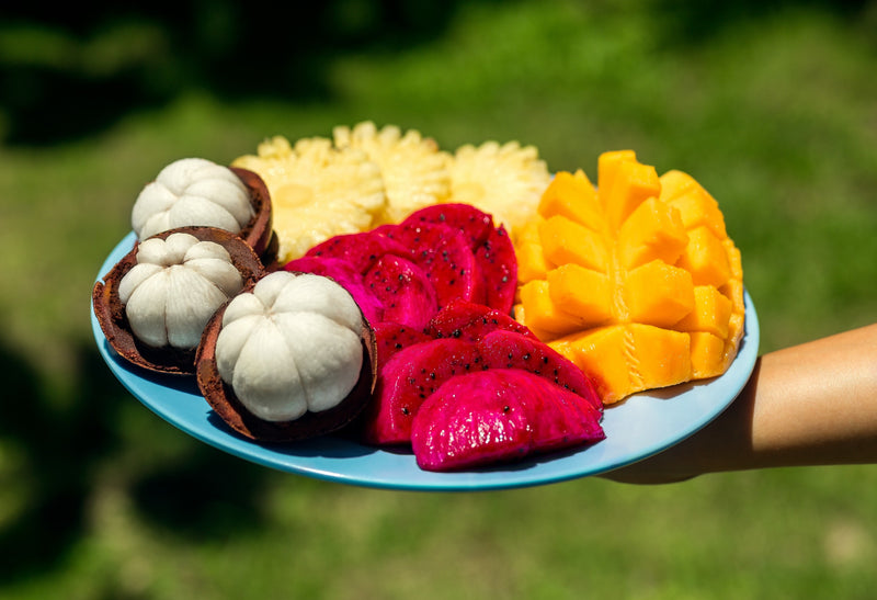 An-exotic-tropical-fruit-display-with-mangosteen-mango-and-red-dragon-fruit