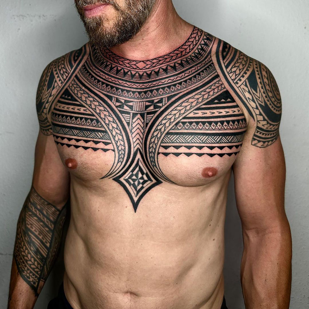 Straight razor tattoo on the chest - Tattoogrid.net