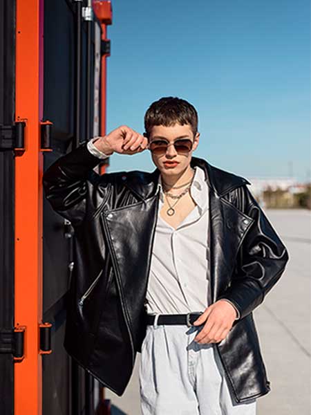 oversized leather jacket styling with casual shirt and trousers