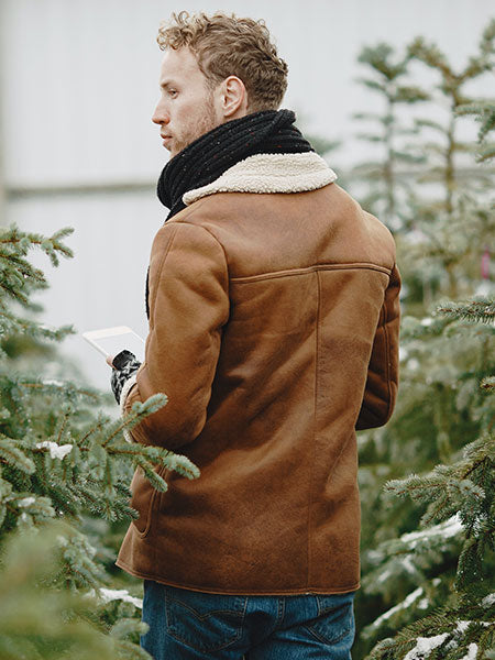 men-brown-fur-leather-jacket-with-blue-jeans-and-black-neck-scarf