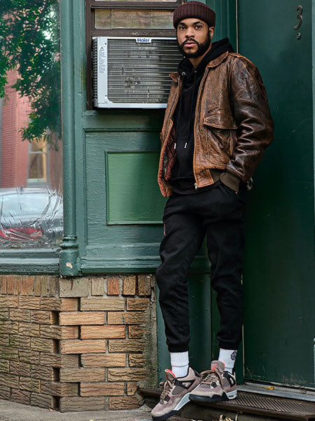 men-brown-vintage-leather-jacket-with-black-hoodie-and-jogger-pants