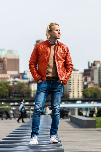 men-orange-leather-jacket-with-blue-jeans-and-earthy-sweater