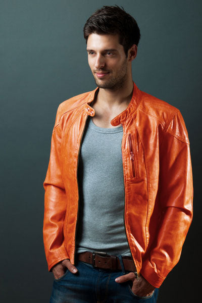 men-orange-leather-jacket-with-grey-tank-top-and-dark-jeans