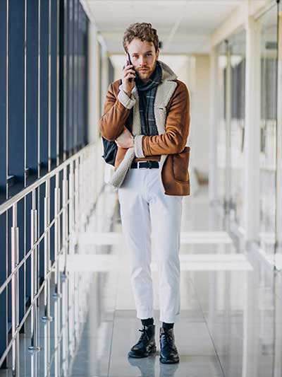 men-tan-leather-jacket-with-white-jeans-and-neck-scarf