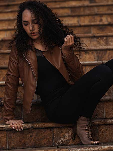 Women-brown-leather-jacket-with-black-outfit-and-brown-heels