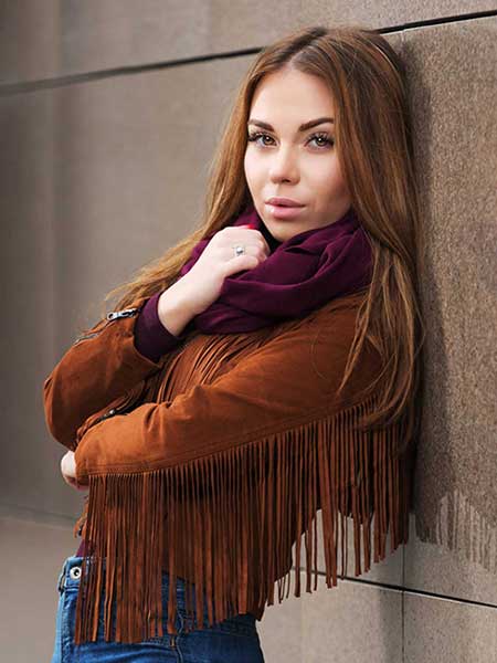 Women-brown-suede-leather-jacket-with-blue-jeans-and-neck-scarf