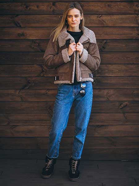 Women-brown-fur-leather-jacket-with-black-shirt-and-blue-jeans