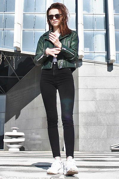 women-green-leather-jacket-with-black-skinny-jeans-and-white-joggers