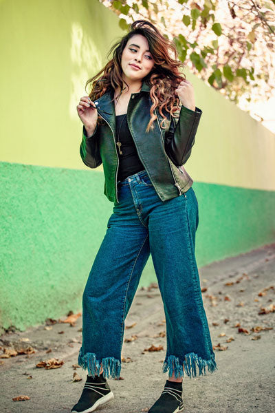 women-green-leather-jacket-with-blue-flare-jeans-and-black-top