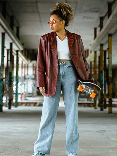 women-burgundy-leather-coat-with-blue-straight-jeans-and-white-blouse