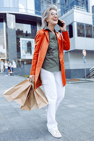 women-orange-leather-jacket-with-white-cargo-pants 