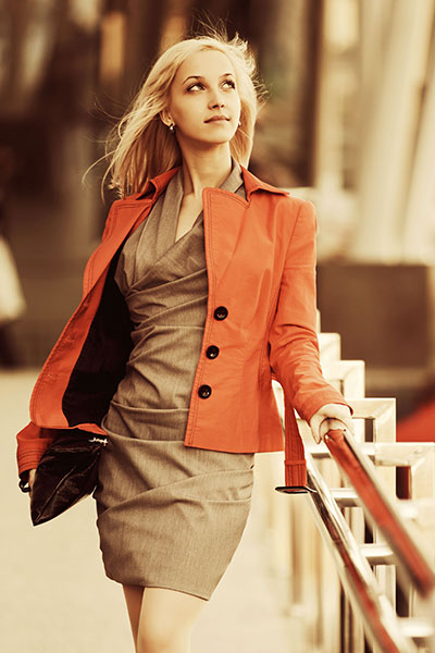 Women-orange-leather-jacket-with-cropped-dress 