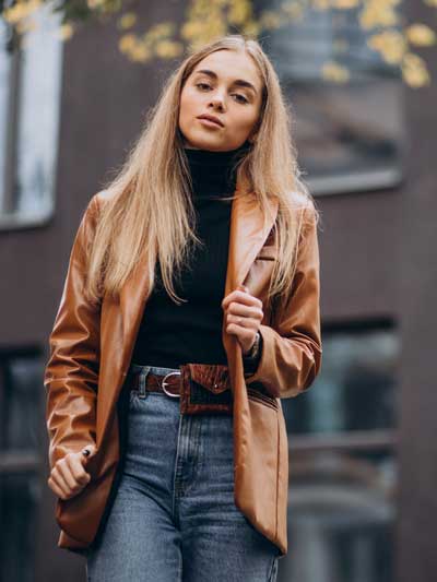 women-tan-leather-coat-with-turtle-neck-sweater-and-high-rise-jeans