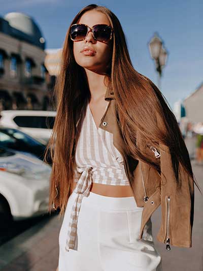 women-tan-leather-jacket-with-an-all-white-outfit