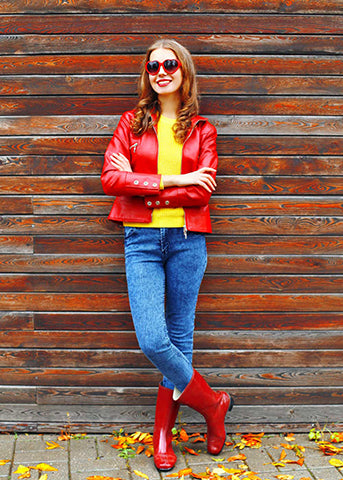 women-in-red-leather-jacket-with-red-sweater-blue-jeans-golden-hairs-and-matching-glasses-and-boots