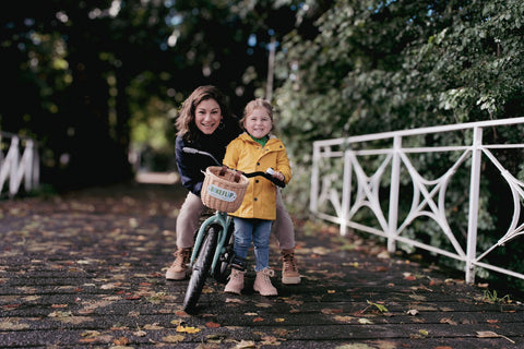 little girl goes cycling with mother - BikeFlip