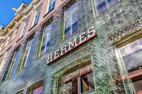 An old Hermès storefront with the Hermès sign above it.