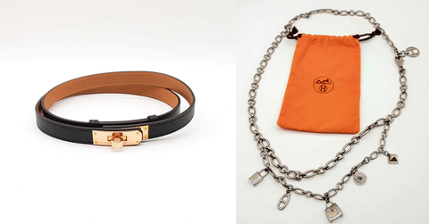 Two Hermès belts are on display. One is leather and the other metal.