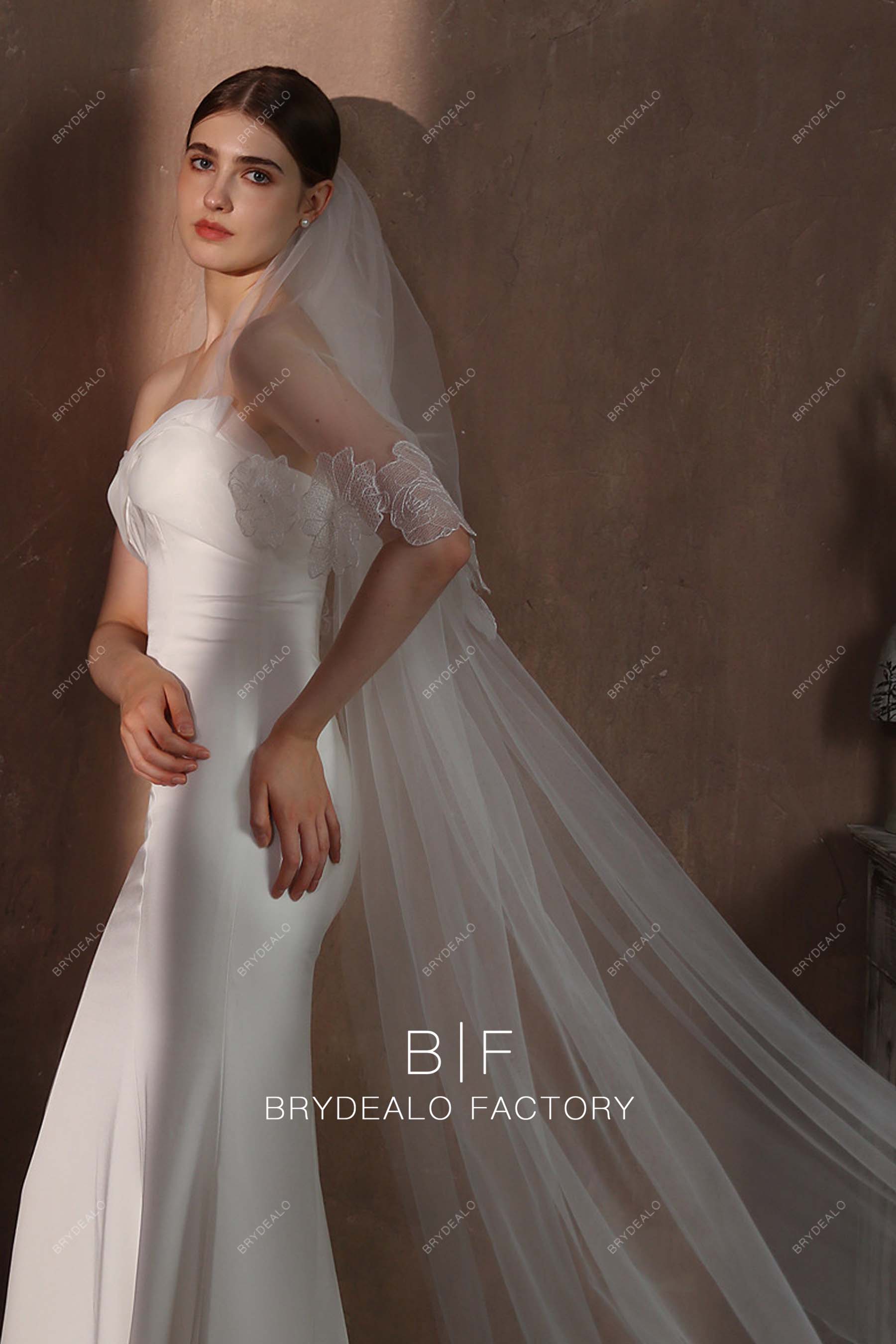 https://cdn.shopify.com/s/files/1/0558/7599/3647/files/lace-edge-two-tiered-brilda-veil-08187.jpg?v=1697696631&width=1800