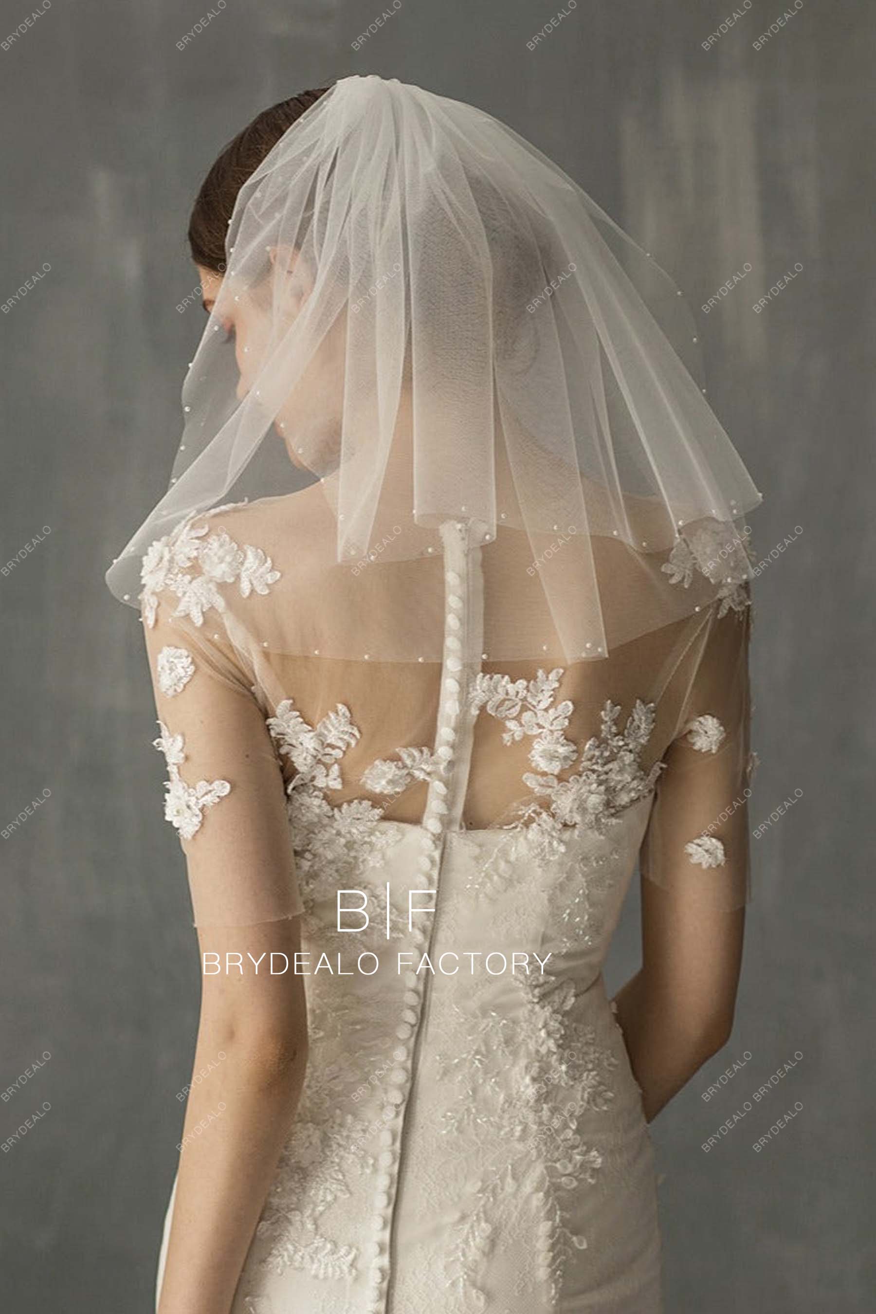 https://cdn.shopify.com/s/files/1/0558/7599/3647/products/2-Tiered-Pearls-Shoulder-Length-Wedding-Veil.jpg?v=1668576377&width=1800