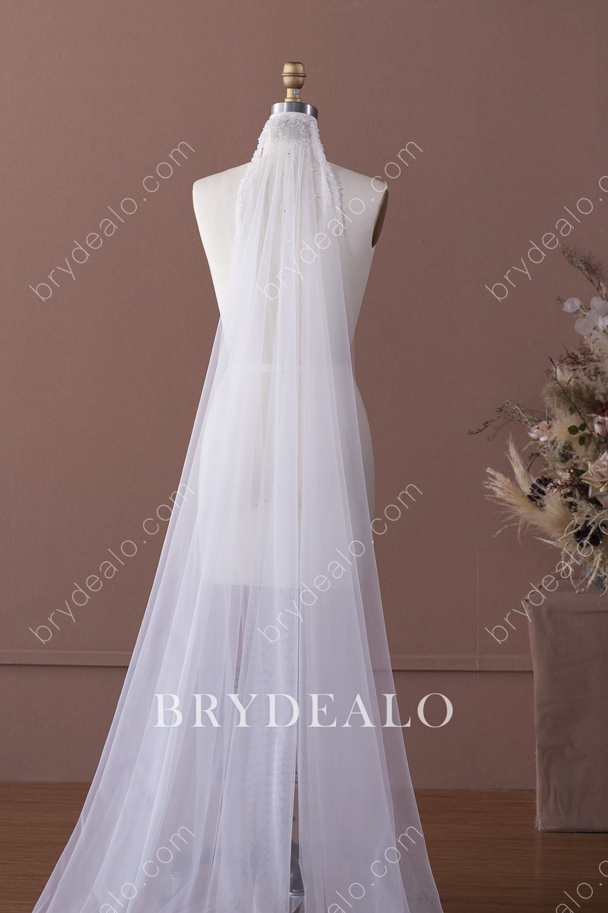 https://cdn.shopify.com/s/files/1/0558/7599/3647/products/chic-beaded-chapel-length-comb-wedding-veil.jpg?v=1644141707&width=1200