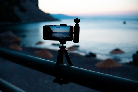 Camera phone on a tripod directed at the sea