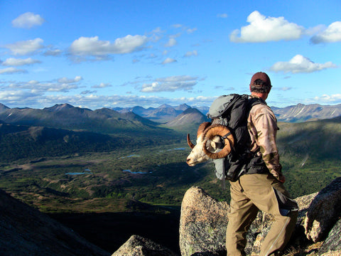 The man is hunting with heated vest