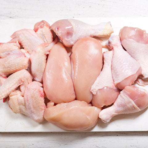 clean, fresh looking raw chicken breasts, legs, and wings