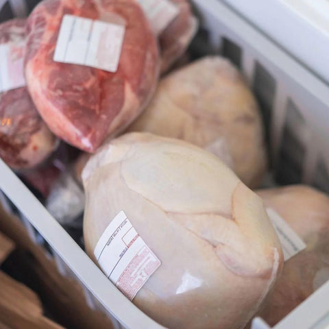 shrink bag wrapped chickens in a cooler