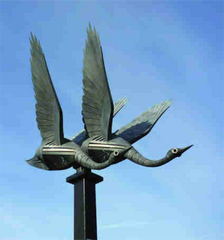 swans in flight sculpture